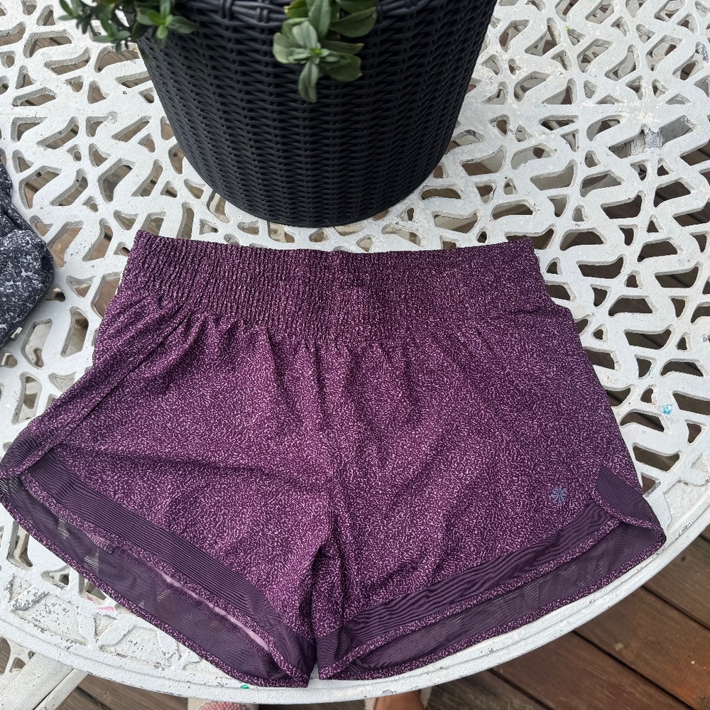 Athleta women’s size M “printed mesh racer run short 4”